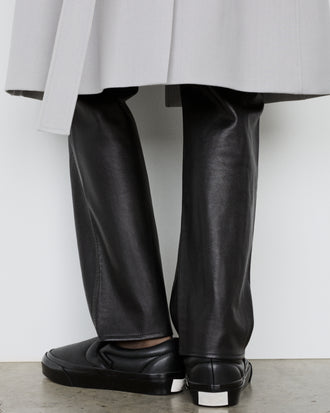 Image of model wearing Vans x Proenza Schouler Puffy Slip-On Shoes in black