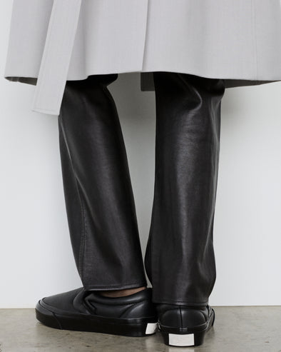 Image of model wearing Vans x Proenza Schouler Puffy Slip-On Shoes in black