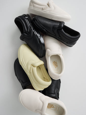 Pile of Vans x Proenza Schouler Puffy Slip-On Shoes in resin, black. and ecru