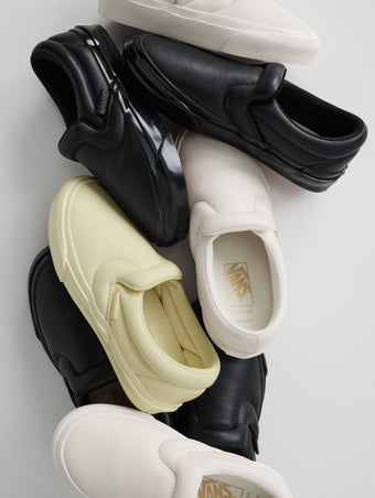 Pile of Vans x Proenza Schouler Puffy Slip-On Shoes in resin, black, and ecru