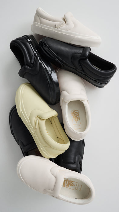 Pile of Vans x Proenza Schouler Puffy Slip-On Shoes in resin, black, and ecru