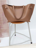 Image of Days Carryall in Smooth Calf in Cumin on a chair