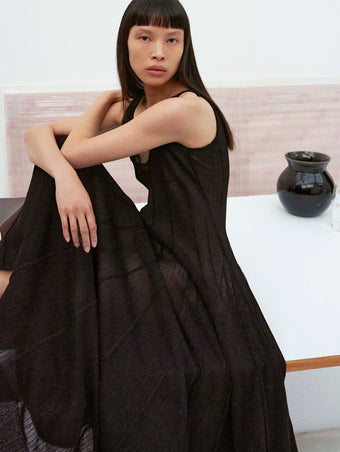 Cropped image of model wearing the Tavia Dress in Viscose Fringe Knit in Black