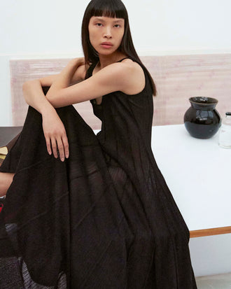 Cropped image of model wearing the Tavia Dress in Viscose Fringe Knit in Black