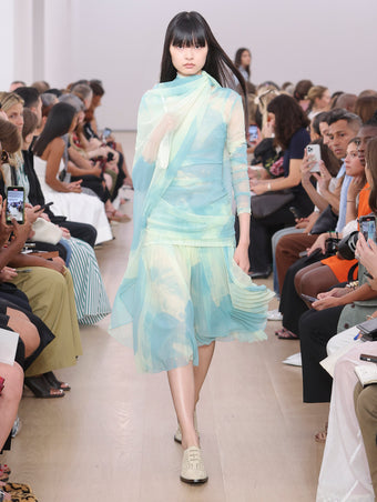 Model Walking Proenza Schouler SS24 Runway In Amber Top In Cyan Printed Nylon Jersey, Judy Skirt In Cyan Printed Nylon Jersey, Flip Shoulder Bag In Optic White Silk Satin, Bronco Oxfords In Birch Perforated Calf