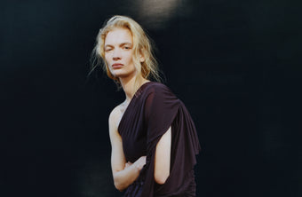 Model Caitlin Soetendal wearing Gabri dress against black backdrop