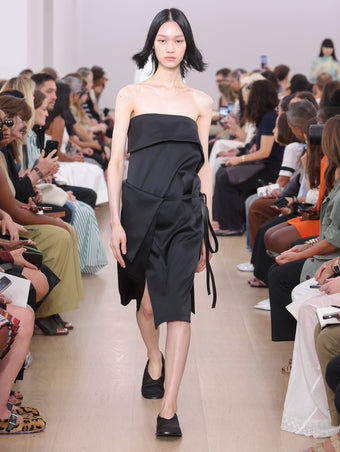 Model Walking Proenza Schouler SS24 Runway In Cecile Dress In Black Matte Satin, Soft Square Slippers In Black Silk Satin
