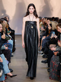 Runway image of model in Nappa Leather Strapless Dress in black