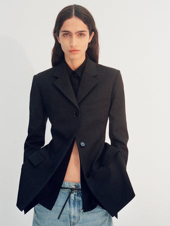 Cropped image of model wearing Lark Blazer in black and Ellsworth Jeans in classic wash