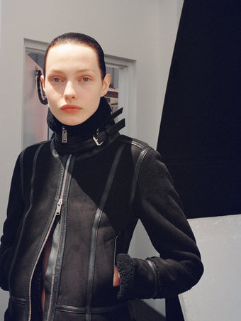 Cropped image of model wearing Arlo Jacket in Suede Shearling in black