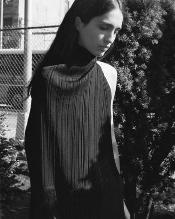 Cropped black and white image of model wearing Everly Dress in Viscose Fringe Knit in black