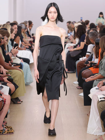 Runway  image of model wearing Cecile Strapless Dress In Matte Satin in black