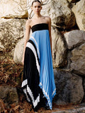 Proenza Schouler Front full length image of model standing against a rock wall wearing Fia Dress In Technical Crepe in Sky Blue Multi 