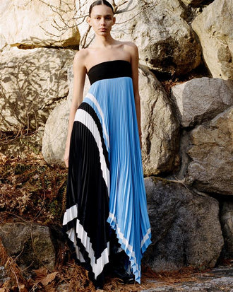 Proenza Schouler Front full length image of model standing against a rock wall wearing Fia Dress In Technical Crepe in Sky Blue Multi 