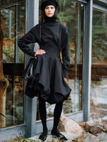 Proenza Schouler Editorial image of model wearing Tiana Dress In Bi Stretch Cotton Nylon in Black