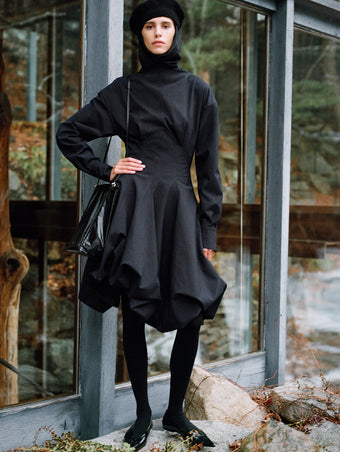 Proenza Schouler Editorial image of model wearing Tiana Dress In Bi Stretch Cotton Nylon in Black