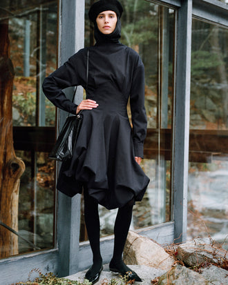 Proenza Schouler Editorial image of model wearing Tiana Dress In Bi Stretch Cotton Nylon in Black
