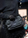 Runway image of Beacon Saddle Bag in BLACK with strap extended