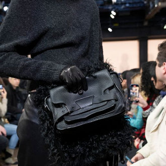 Runway image of Beacon Saddle Bag in BLACK with strap extended