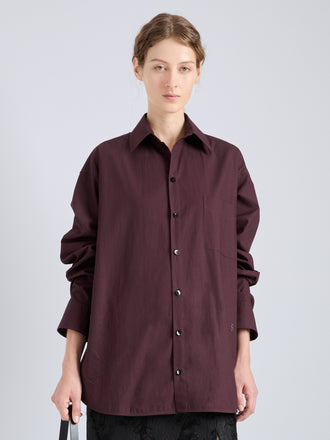 Proenza Schouler Cropped Front Image of model wearing Alia Top in Classic Cotton Shirting in Aubergine