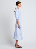 Proenza Schouler Side full length image of model wearing Alicia Dress in Crinkled Cotton Gabardine in SKY BLUE