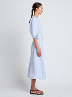 Proenza Schouler Side full length image of model wearing Alicia Dress in Crinkled Cotton Gabardine in SKY BLUE