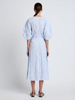 Proenza Schouler Back full length image of model wearing Alicia Dress in Crinkled Cotton Gabardine in SKY BLUE