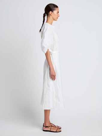 Proenza Schouler Side full length image of model wearing Alicia Dress in Crinkled Cotton Gabardine in WHITE