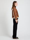 Proenza Schouler Side image of model wearing Arlo Jacket in Leather Back Shearling in umber