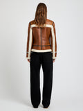 Proenza Schouler Back image of model wearing Arlo Jacket in Leather Back Shearling in umber