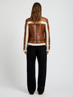 Proenza Schouler Back image of model wearing Arlo Jacket in Leather Back Shearling in umber