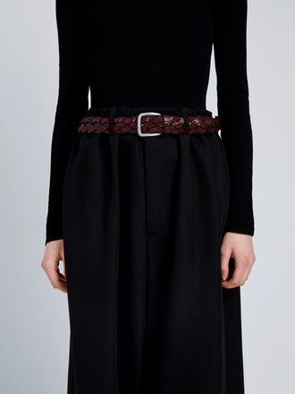 Proenza Schouler Image of model wearing Wide Braid Belt in Croc Embossed Calf in Bordeaux