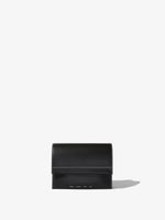 Image of model carrying Accordion Flap Bag in BLACK in hand