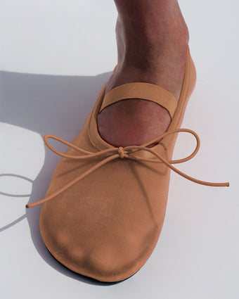 Cropped image of model wearing Glove Mary Jane Ballet Flats in Mesh in terracotta