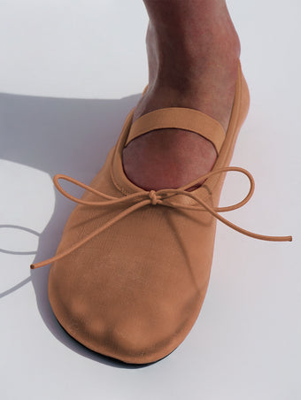 Image of model wearing Glove Mary Jane Ballet Flats in Satin in terracotta