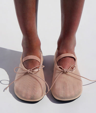 Cropped image of model wearing Glove Mary Jane Ballet Flats in Satin in NUDE