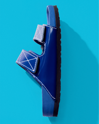 Aerial side image of Birkenstock x Proenza Schouler Arizona Slides in cobalt on tonal blue backdrop