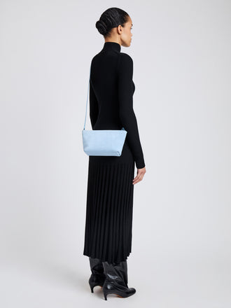 Proenza Schouler Image of model wearing  Bond Bag in Suede in Powder