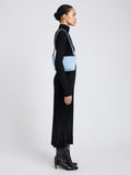 Proenza Schouler Image of model wearing Bond Bag in Suede in Powder 