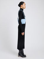 Proenza Schouler Image of model wearing Bond Bag in Suede in Powder 
