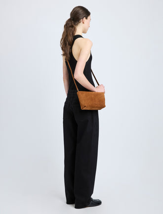 Proenza Schouler model wearing Bond Bag in Suede in saddle