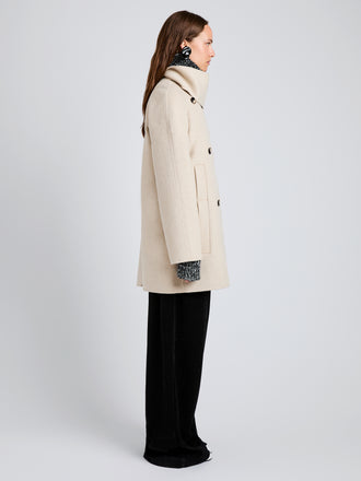 Proenza Schouler Side full length image of model wearing Brisa Coat in Lightweight Double Face Wool in Off White