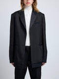 Proenza Schouler detail image of model wearing Bronte Jacket in Wool Twill Suiting with Organza in black