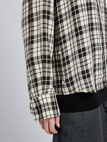 Proenza Schouler detail image of model wearing Bronwen Top in Crinkled Plaid in garnet multi