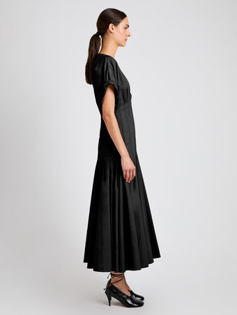 Proenza Schouler side image of model wearing Ciara Dress in Eco Compact Poplin in black