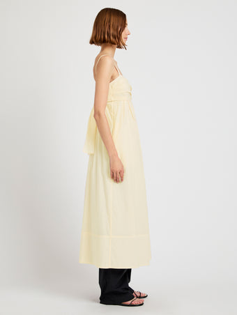 Proenza Schouler Side full length image of model wearing Claudine Dress in Tech Poplin in Light Butter