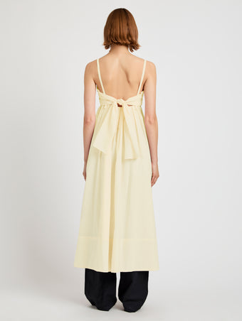 Proenza Schouler Back full length image of model wearing Claudine Dress in Tech Poplin in Light Butter