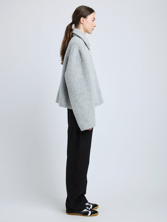 Side image of model wearing Darcy Jacket in Brushed Wool Cashmere in light grey melange