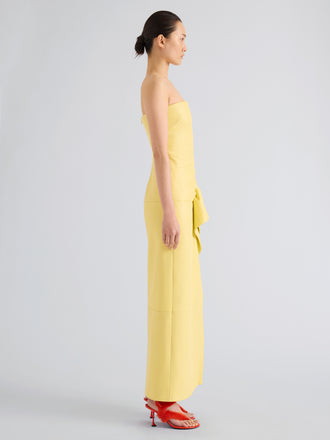 Proenza Schouler Full length side image of model wearing Alonna Dress in Leather in Pale Yellow