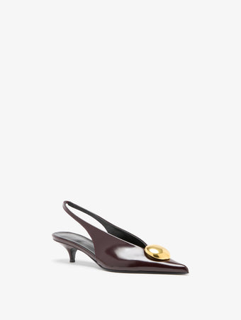 Proenza Schouler 3/4 Still Life image of Dome Slash Slingbacks in Polished Calf in Merlot